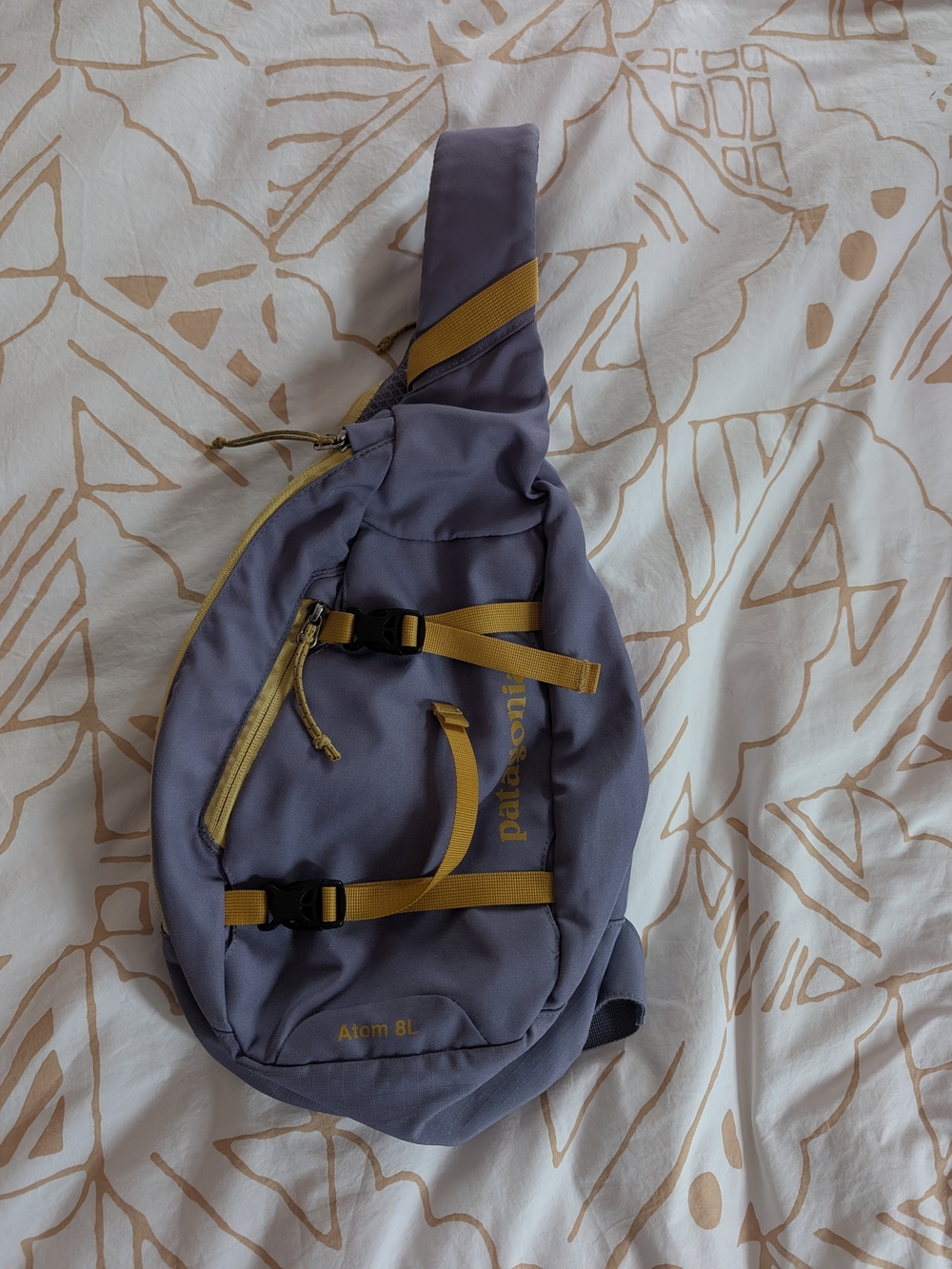 Patagonia 8L Atom Sling bag In Dusty Purple